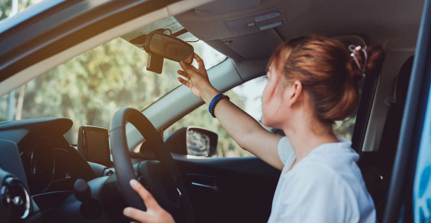 Person checking their rear view mirror.