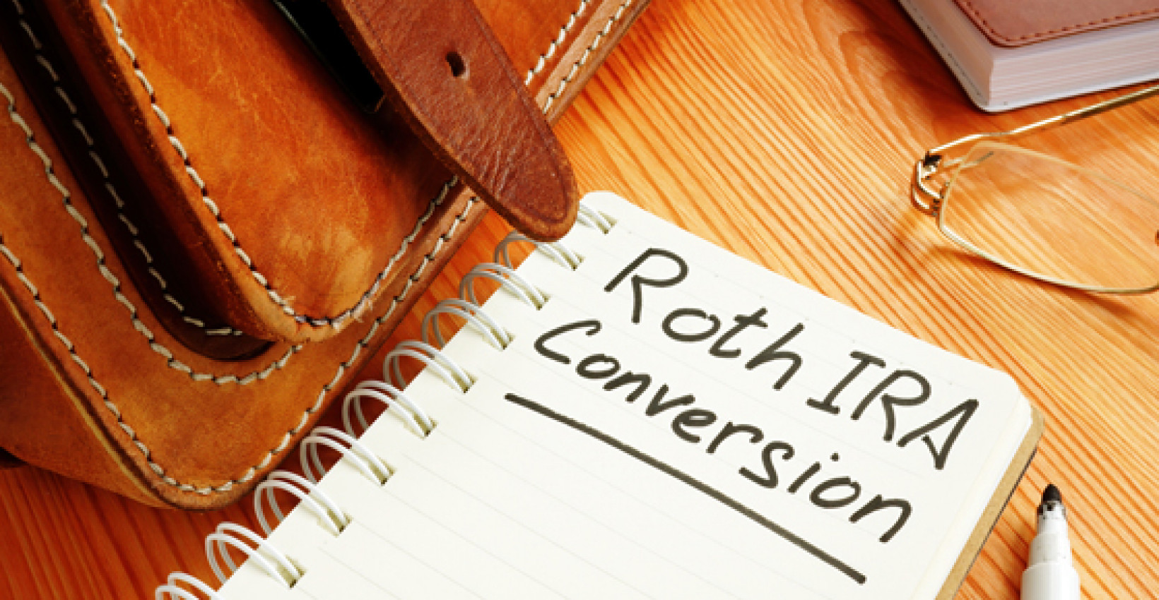 A notebook page with "Roth IRA conversion" written on it