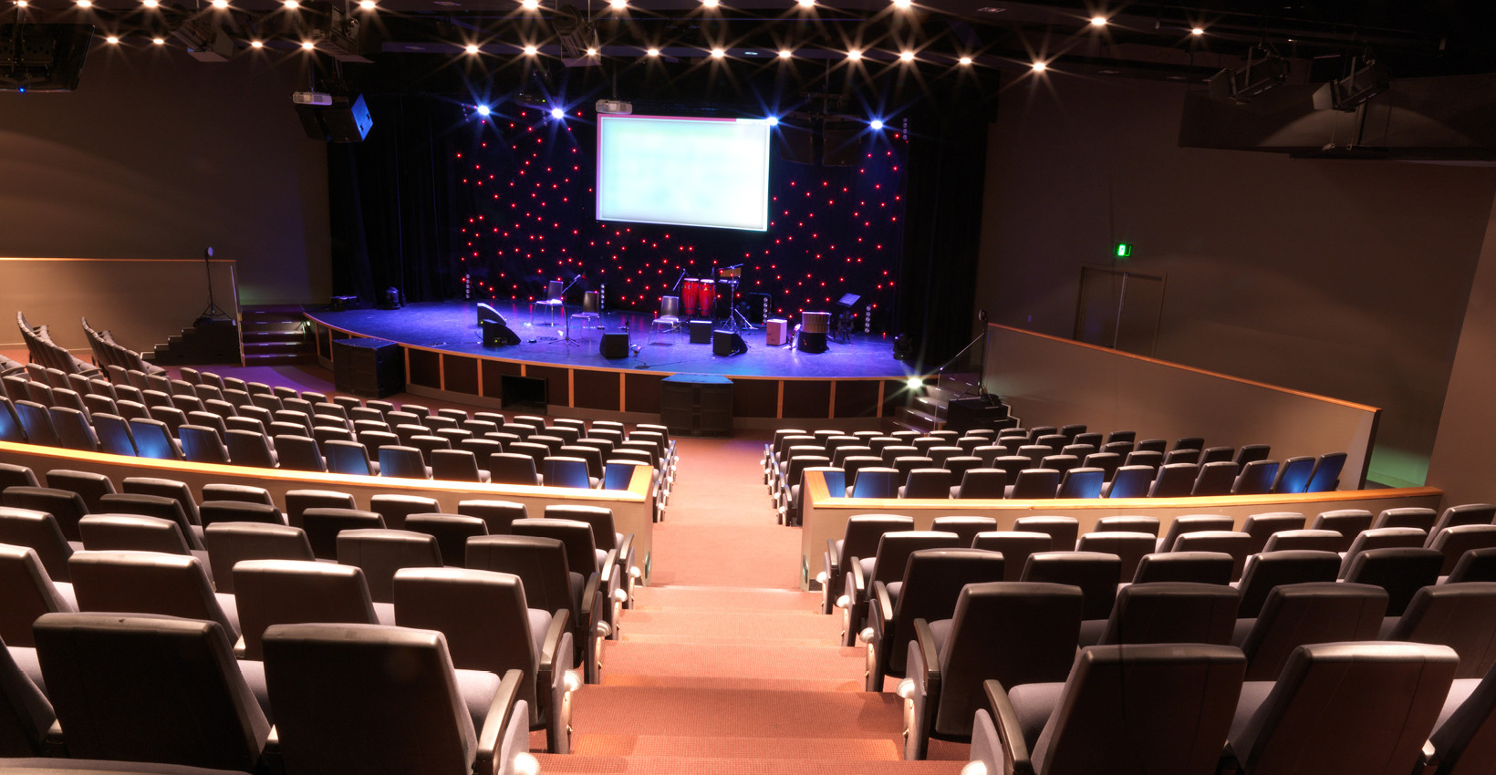 A modern church as viewed from the back looking at the stage