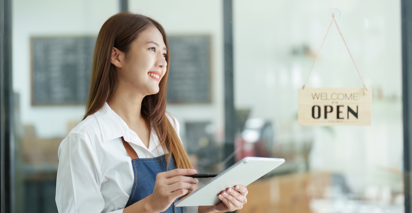 woman business owner smiles