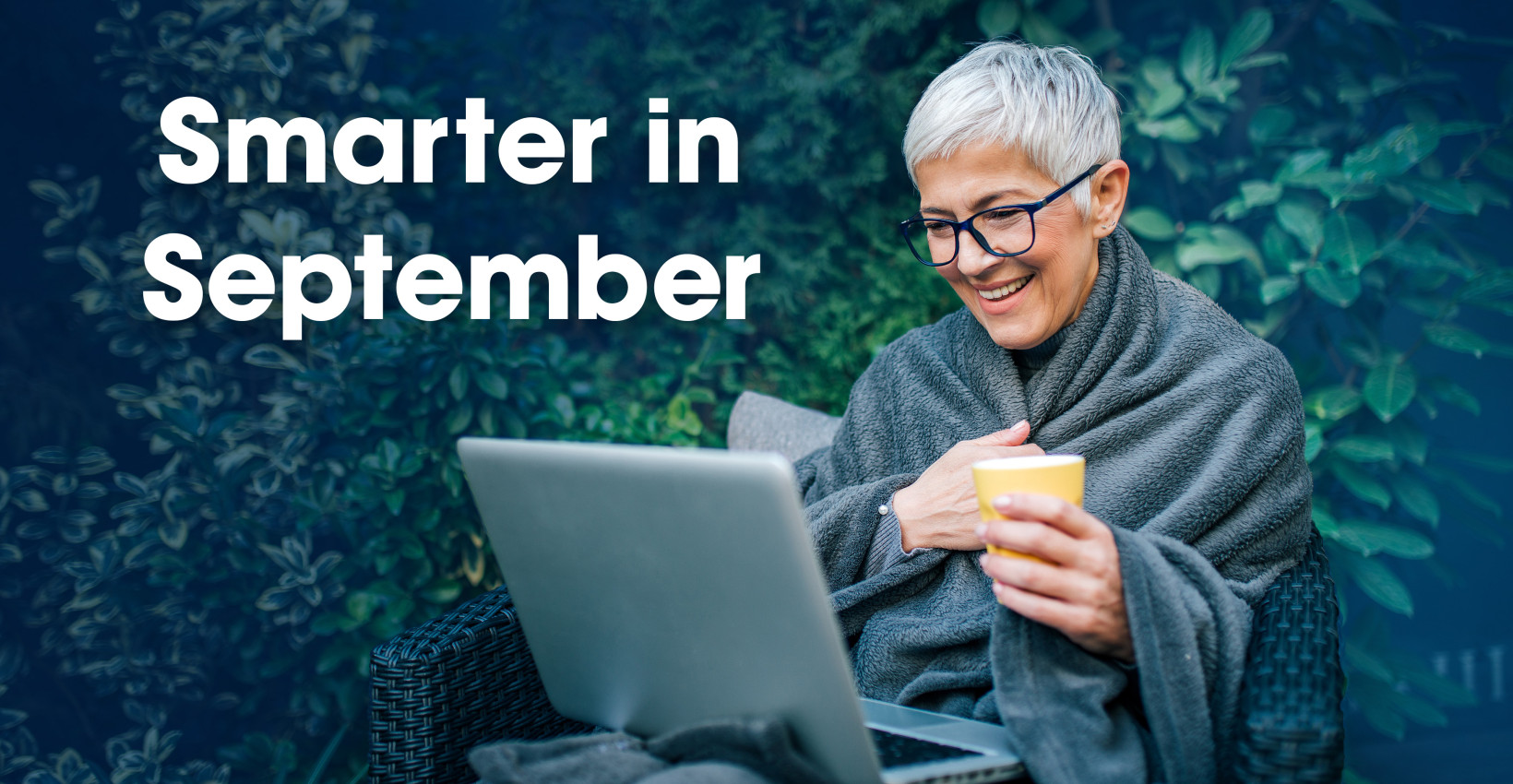 smarter in september woman smiling at computer