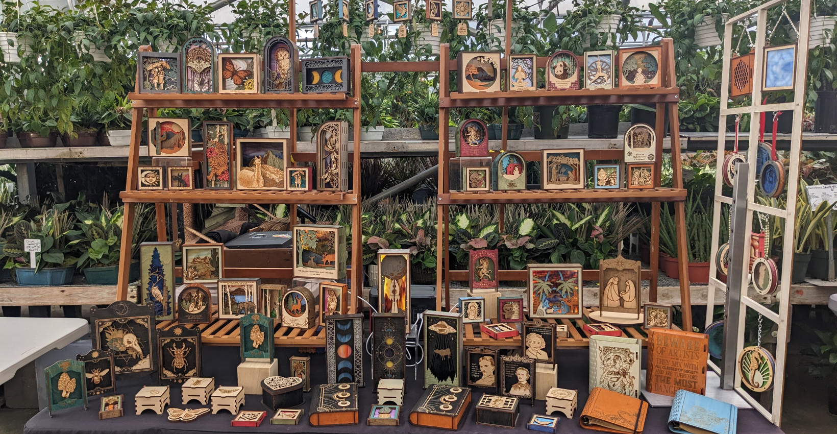 A collection of handmade wooden objects on sale at a vendor booth