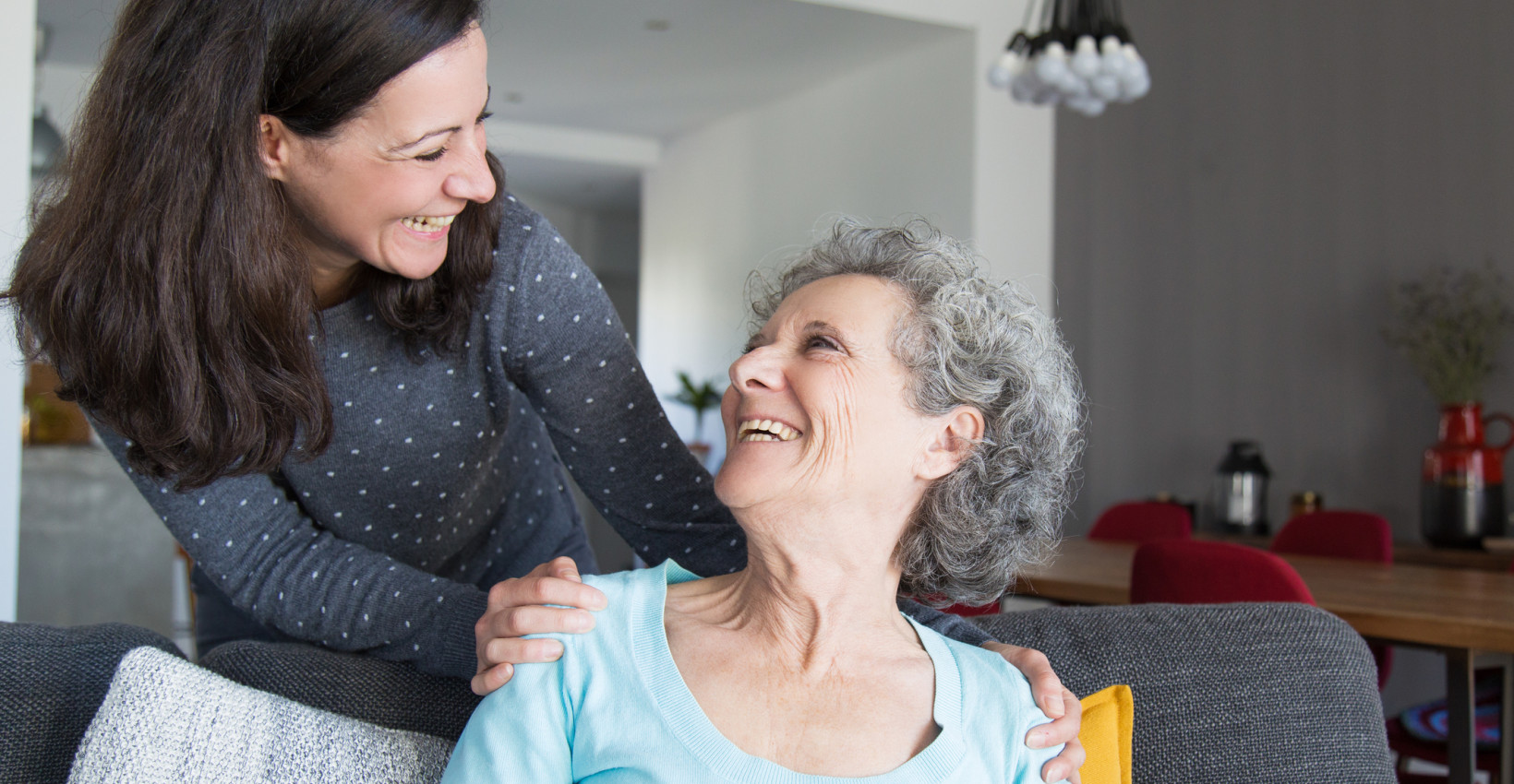 a mother and daughter laugh together