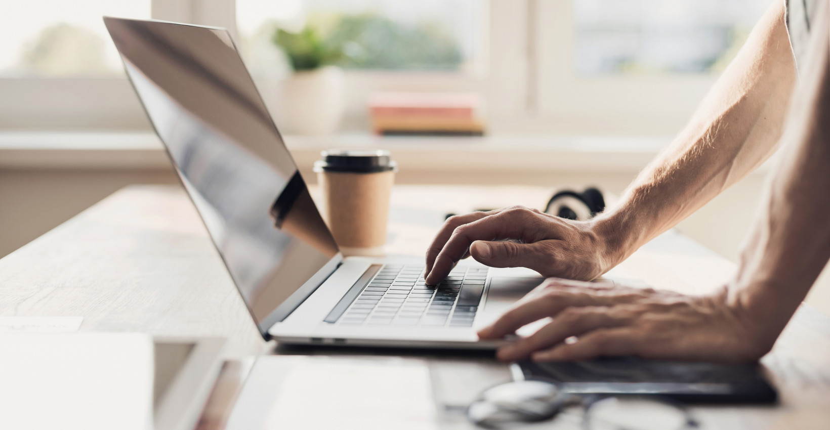 a person uses a laptop on the table