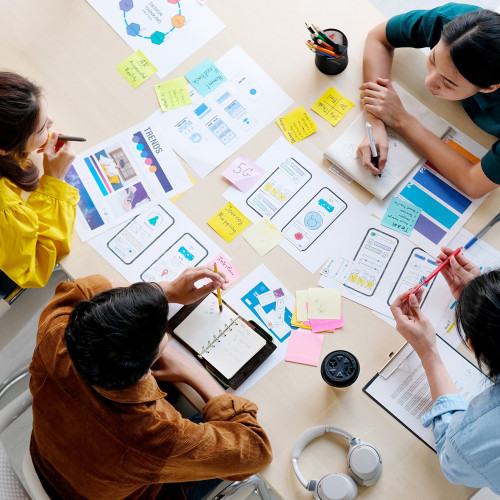 People making business plans around a table