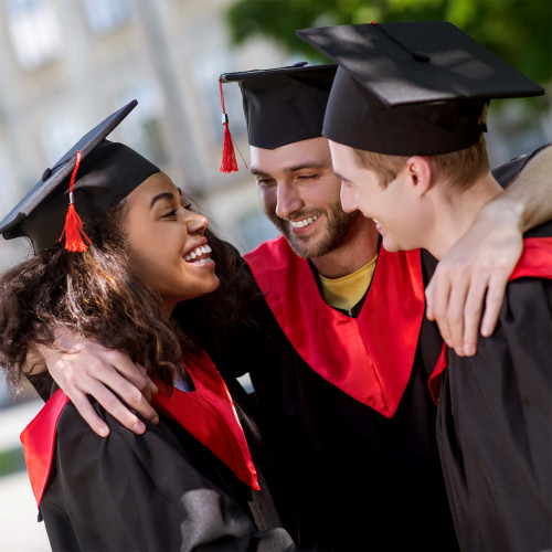 A group of graduates with their arms around each other