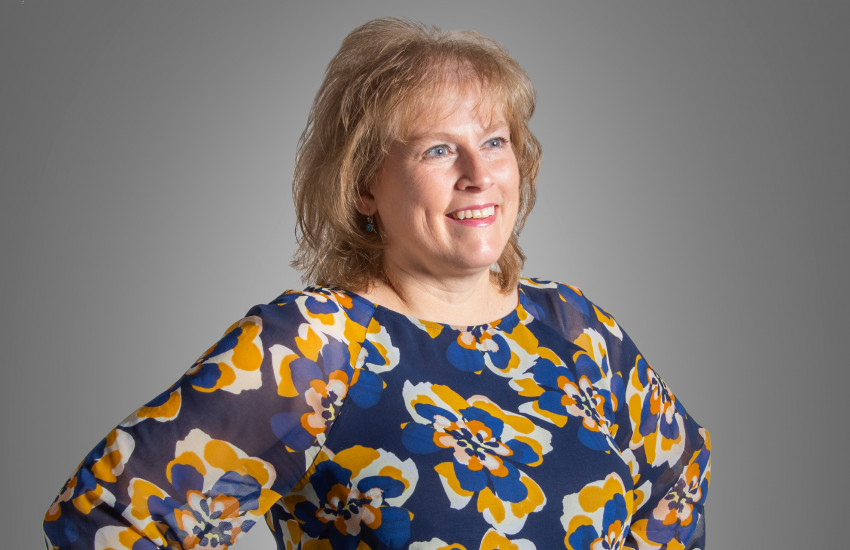 A headshot of Laura Lyons