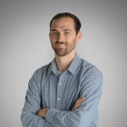 A headshot of Travis Weyers
