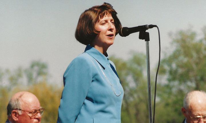 Angie speaking at an event