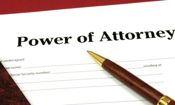 A pen resting on a document called Power of Attorney