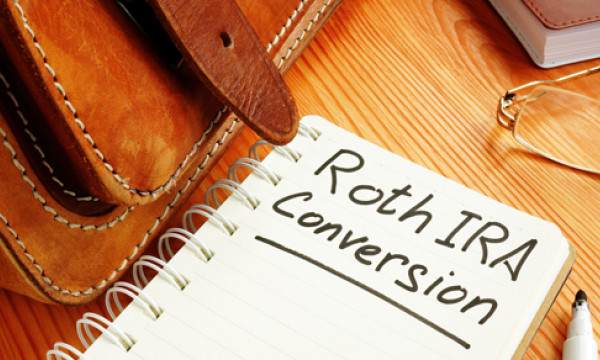 A notebook page with "Roth IRA conversion" written on it