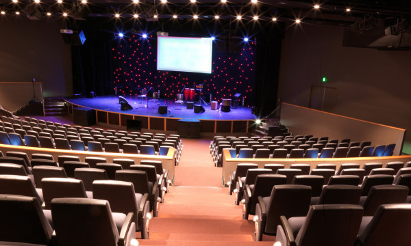 A modern church as viewed from the back looking at the stage