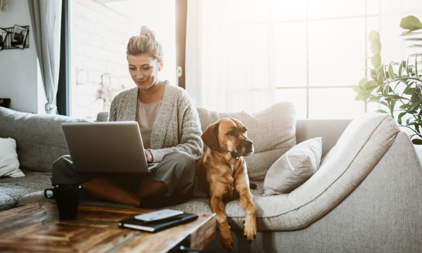 Woman on sofa with laptop