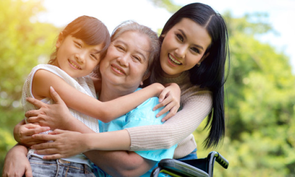grandma, mother, and daughter all smile