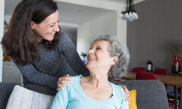 a mother and daughter laugh together