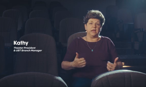Kathy Klammer sitting in a theater seat