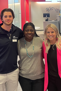 A picture of Margaret with two UBT employees at the UBT branch in the student union at UNL.